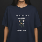 Navy T-shirt with “mama est. 2020” script, floral bouquet graphic, and “Freya • Jude” text
