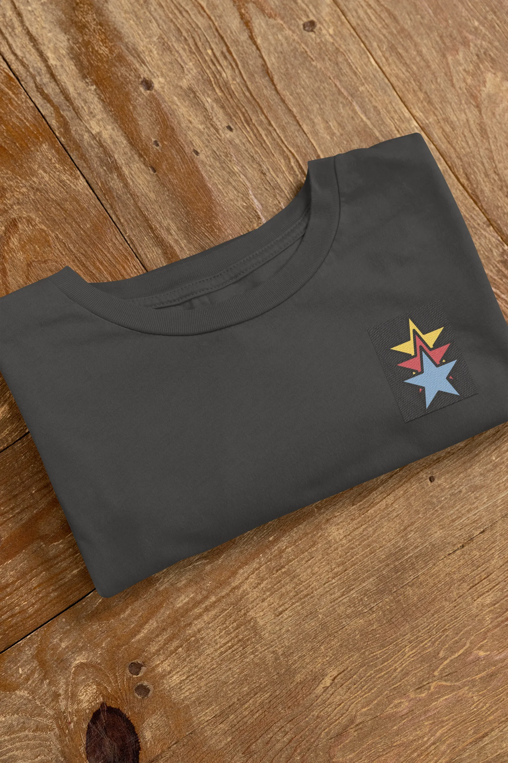 Black unisex sweatshirt flat lay with star embroidery on front