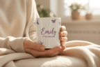 White ceramic butterfly mug with purple butterflies, name Emily and date text