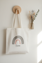 White tote bag with rainbow arch graphic and name Emma