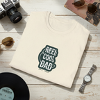 Light cream crewneck graphic T-shirt with green 'REEL COOL DAD' logo, EST 1980