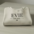 Cream crewneck sweatshirt with EVIE and Est.2021 print