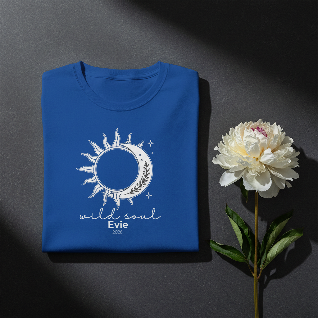 Royal blue graphic T-shirt with sun-and-moon emblem and 'wild soul Evie 2026'