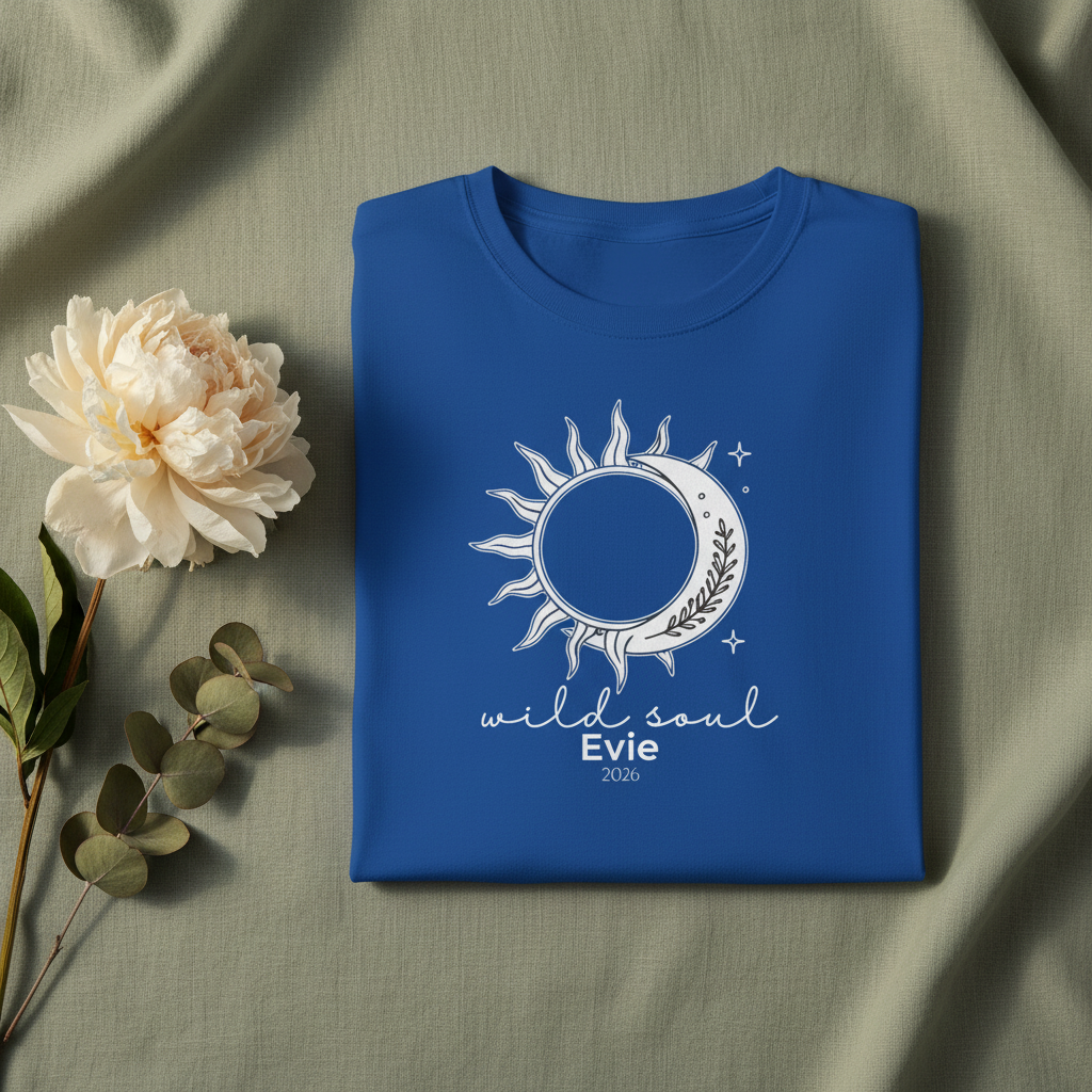 Royal blue graphic T-shirt with sun-and-moon emblem and 'wild soul Evie 2026'