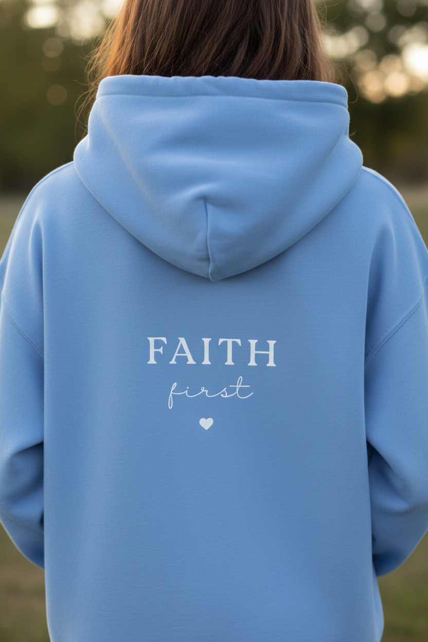 Light blue unisex hoodie with 'FAITH first' chest print and kangaroo pocket
