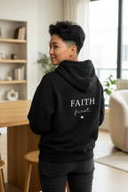 Black unisex hoodie sweatshirt with hood and back 'FAITH first' graphic with heart