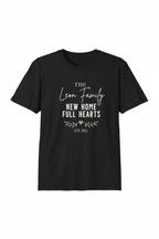 Black short-sleeve t-shirt with 'The Leon Family' new home text and small heart graphic