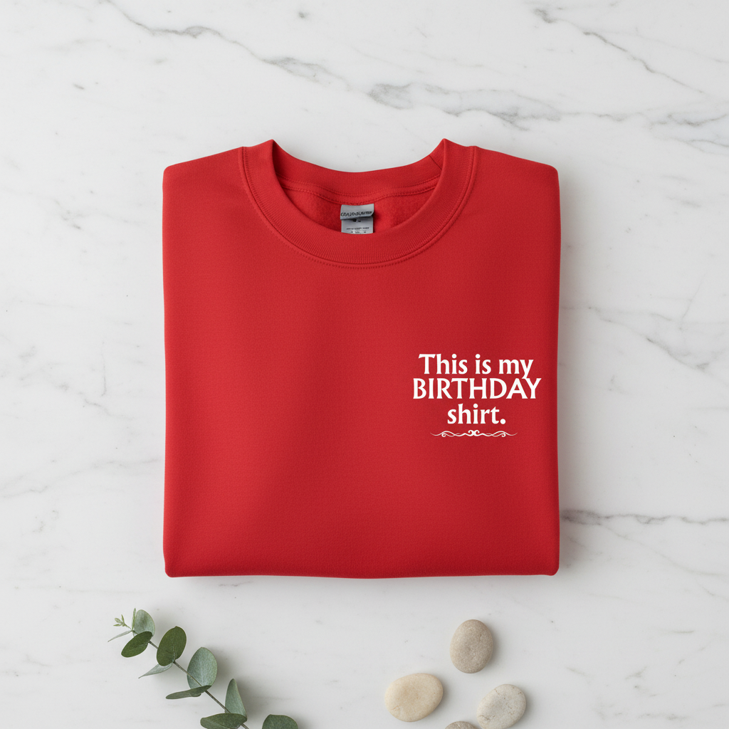 Fire red crewneck birthday shirt with “This is my BIRTHDAY shirt” print.