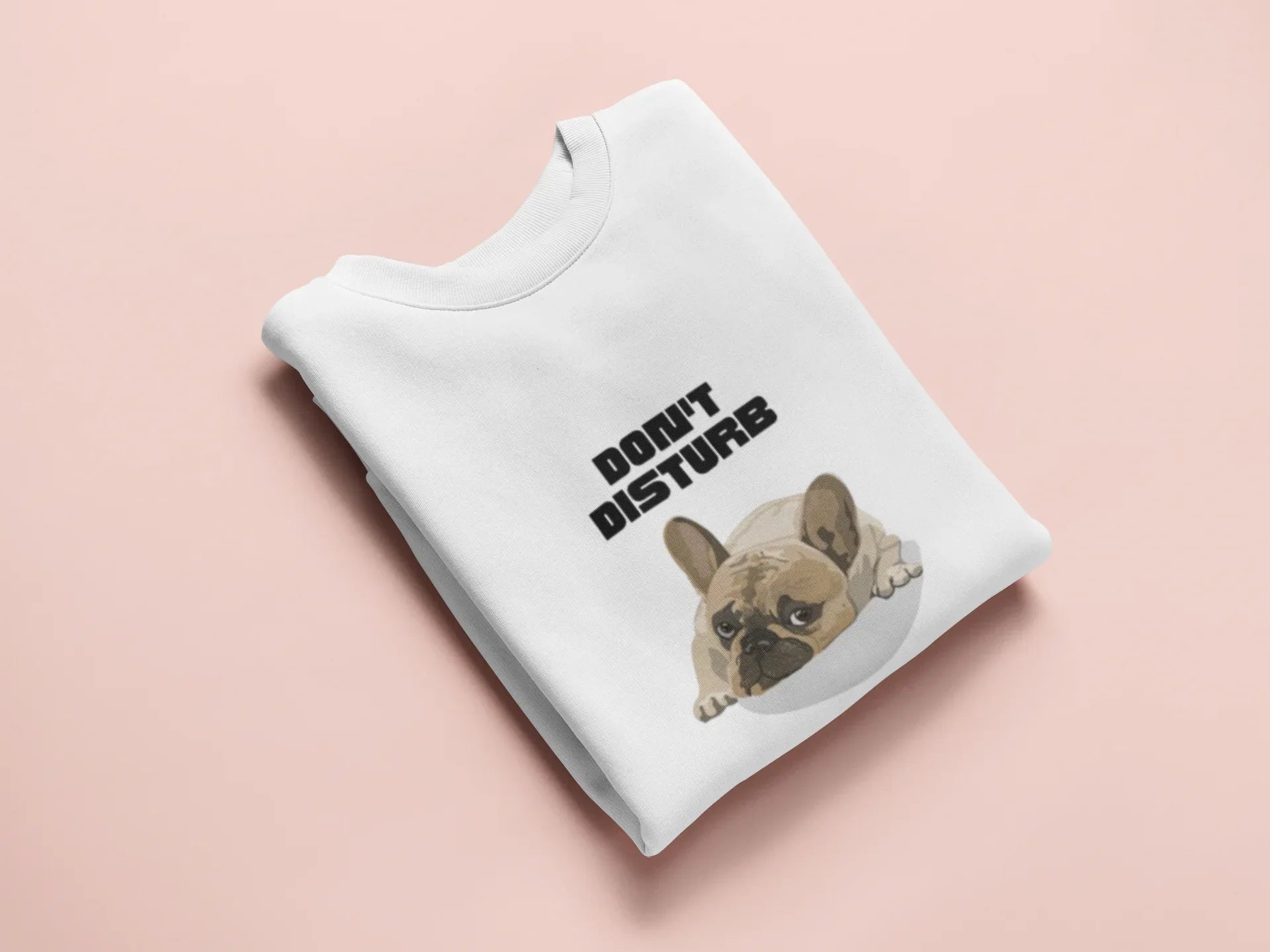 White sweatshirt with “DON’T DISTURB” text and sleeping French Bulldog graphic.