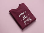 Maroon sweatshirt with 'Happy Birthday' cake graphic and custom name text