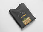 Charcoal gray crewneck sweatshirt with “Happy birthday” cake and candle graphic