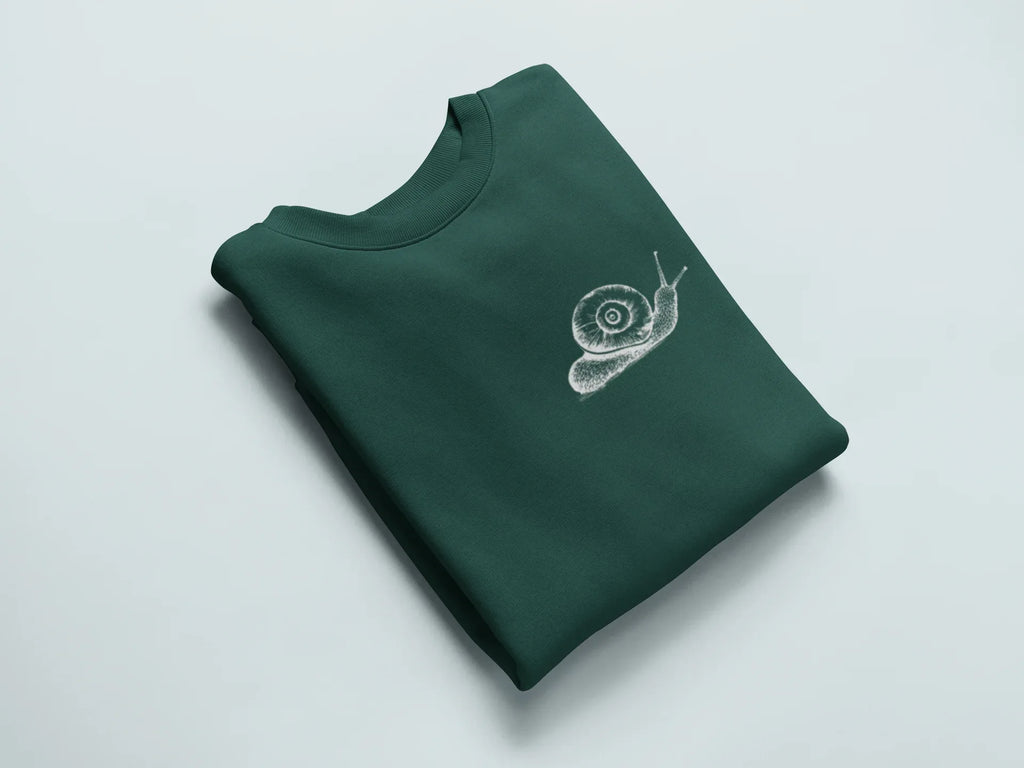 Dark green sweatshirt with a white snail graphic on the chest.