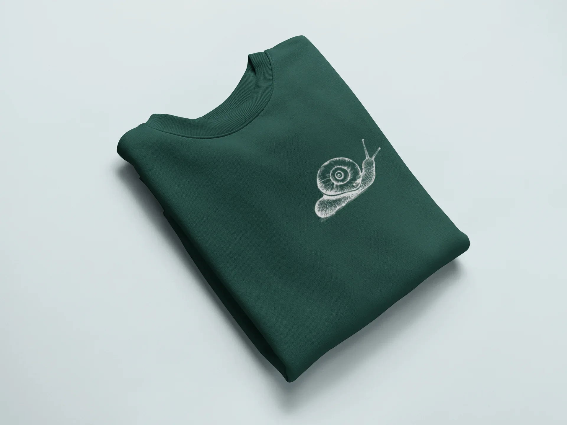 Dark green sweatshirt with a white snail graphic on the chest.