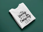 White sweatshirt with “Camping Life” graphic on front
