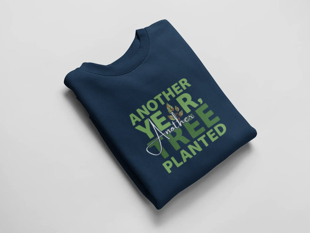 Navy crewneck sweatshirt with green “Another Year, Tree Planted” chest graphic.