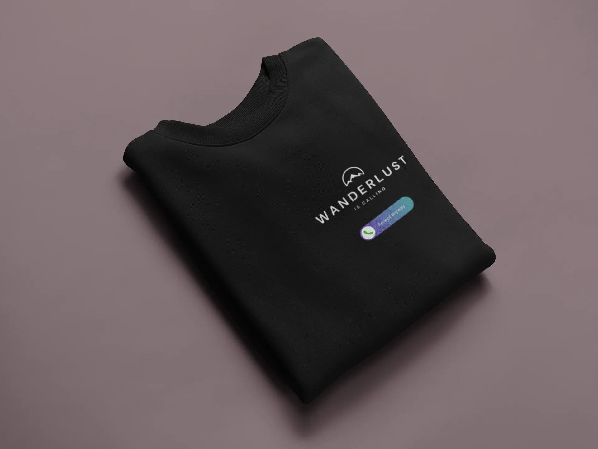 Black crewneck sweatshirt folded, with Wanderlust logo and badge on chest