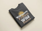 Charcoal crewneck sweatshirt with “Wild hearts Protect Wild Places” graphic on chest