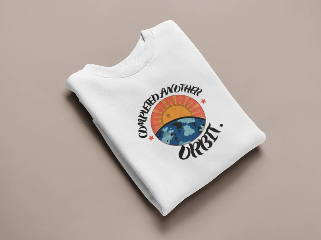 White crewneck sweatshirt with arched space graphic and “Orbit!” wordmark