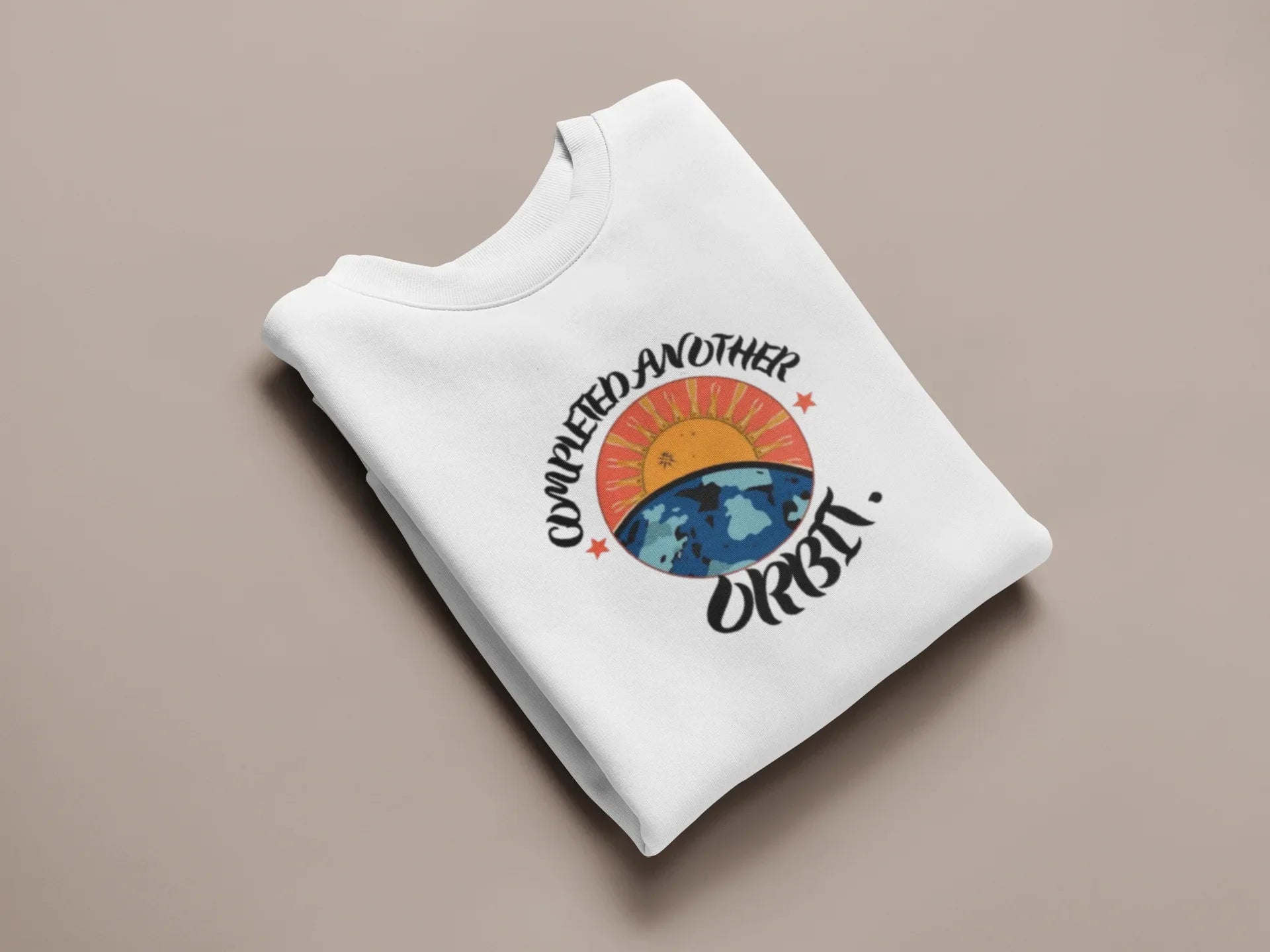 White crewneck sweatshirt with arched space graphic and “Orbit!” wordmark