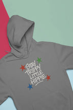 Gray hoodie with front "Stay Trippy Little Hippie" star text graphic