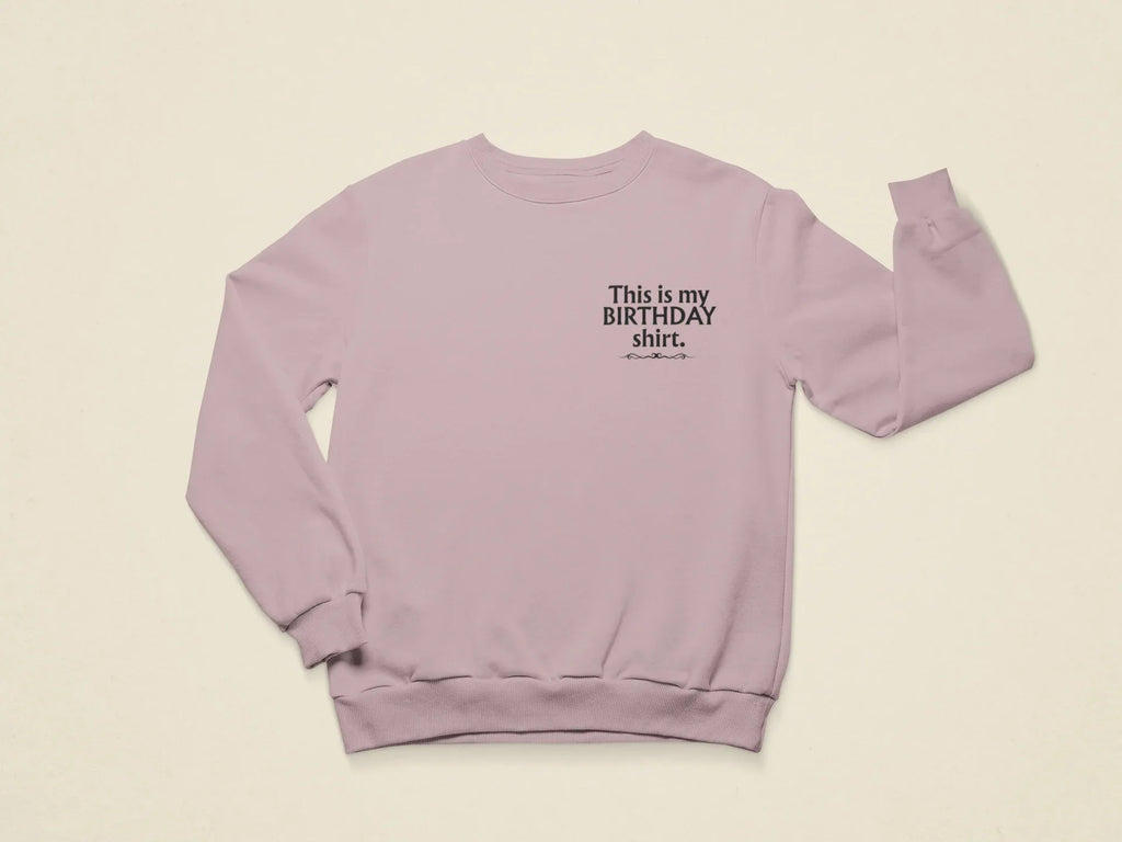 Light purple crewneck birthday sweatshirt with printed “This is my BIRTHDAY shirt”