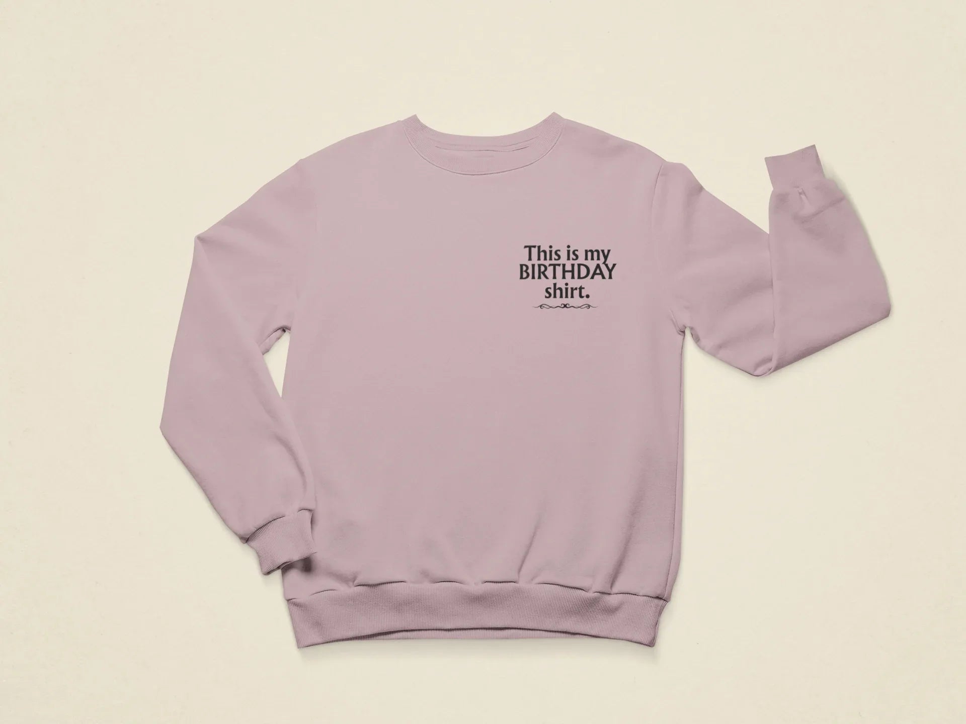 Light purple crewneck birthday sweatshirt with printed “This is my BIRTHDAY shirt”