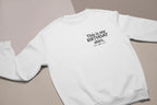 White crewneck birthday sweatshirt with printed “This is my BIRTHDAY shirt”