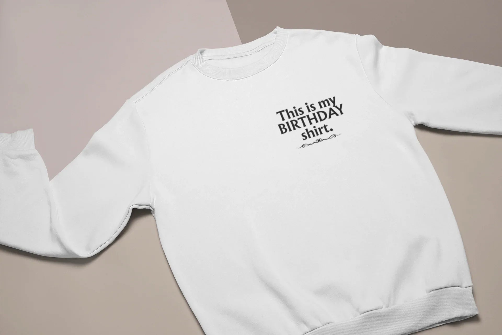 White crewneck birthday sweatshirt with printed “This is my BIRTHDAY shirt”