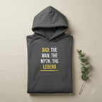 Charcoal gray hoodie with “DAD: THE MAN, THE MYTH, THE LEGEND” graphic centered