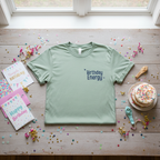 Seafoam green T-shirt with Birthday Energy+ graphic