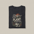 Dark t-shirt with 'crazy plant person' botanical print and bird graphic