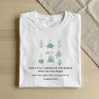 White botanical t-shirt with potted succulent and leaf graphic plus story text