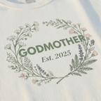 White t-shirt with Godmother floral wreath and Est. 2025 print