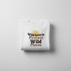 White crewneck sweatshirt with “Wild hearts Protect Wild Places” chest graphic