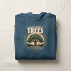 Indigo blue unisex hoodie folded with “Plant More Trees” chest graphic