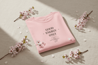Pink T-shirt with 'Good Energy Only' graphic on the chest, short sleeves