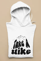 White hoodie with hood and front Take a Hike mountain graphic, laid flat.