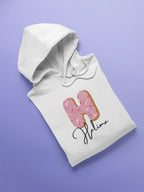 Kids white hoodie sweatshirt with pink donut graphic and script name