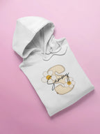 Kids white hoodie laid flat with hood; front floral name graphic on chest