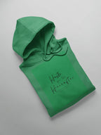 Irish green pullover hoodie folded with chest script graphic