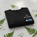 Folded deep black sweatshirt with Nature is Calling logo on chest
