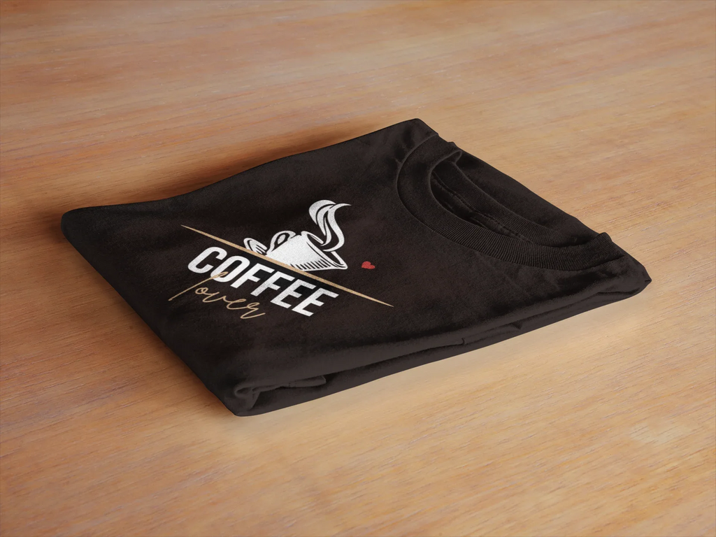 Folded black unisex T-shirt with coffee cup graphic on the front