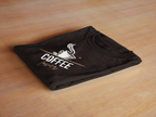 Folded black unisex T-shirt with coffee cup graphic on the front