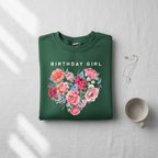 Forest green sweatshirt with “BIRTHDAY GIRL” text and floral heart graphic