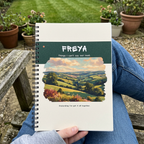 Freya countryside notebook on a lap in a British garden