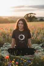 Black graphic T-shirt with sun-and-moon emblem print on the chest.