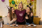 Maroon sweatshirt with floral heart and “BIRTHDAY GIRL” text on the chest