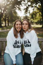 White Take a Hike hoodie with hood and front Take a Hike mountain graphic.