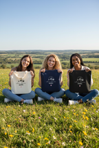 Cotton tote bags in white, navy blue, and black with mountain sketch and heart print