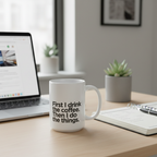 White ceramic coffee mug with quote text on a wooden desk.